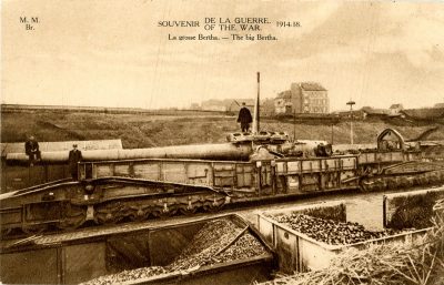 A postcard features the picture of a large piece of artillery.