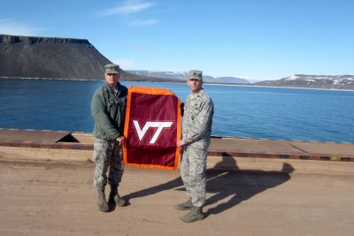 Eric Dorminey, at left, and Lt. Col. Marty Easter ‘96 show their Hokie pride 700 miles inside the Arctic Circle at Thule Air Base, Greenland.
