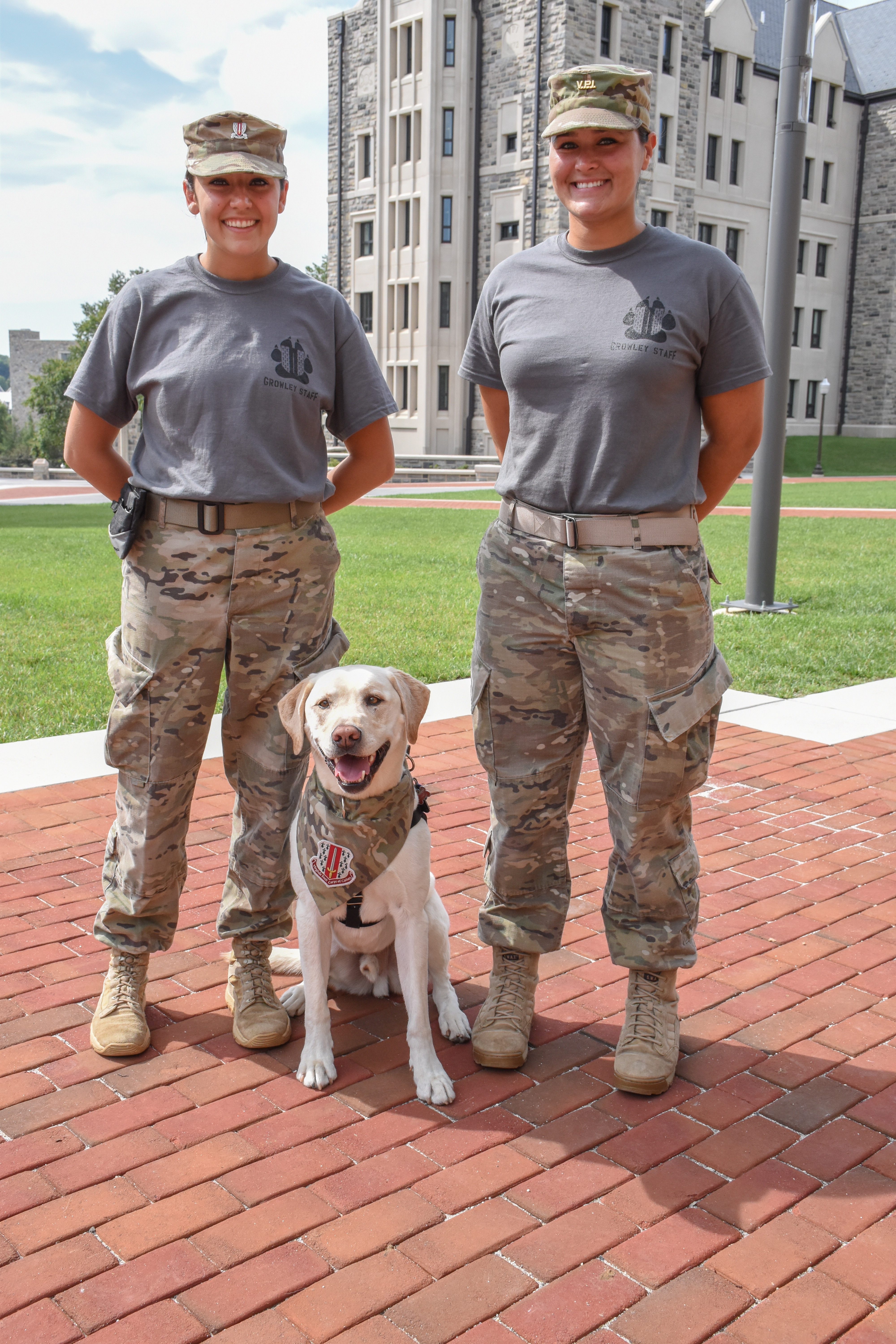 Eleanor Franc stands with Growley and another cadet member of Growley Team