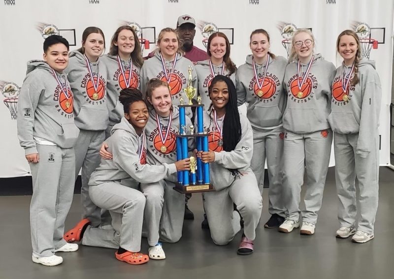 The Corps Women's Basketball team poses with their trophy after winning the Flyin' Irish Tournament