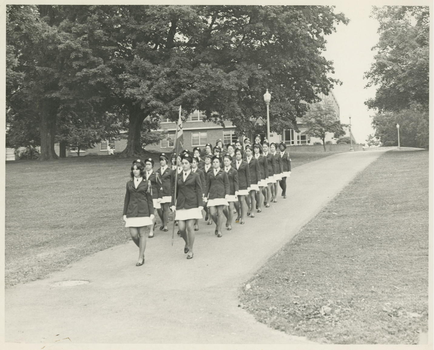 Women cadets in L Squadron marching on campus