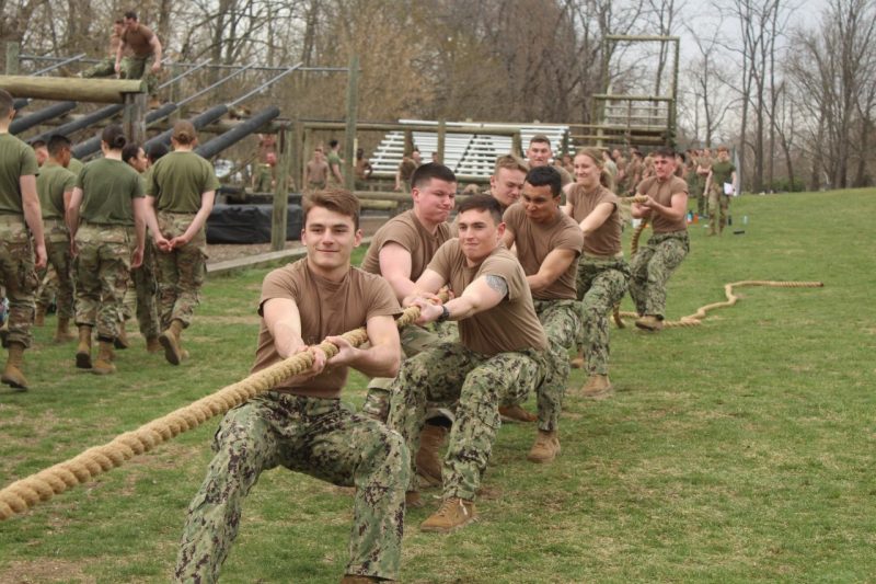 Midshipmen pull on a rope during a game of tug-of-war.