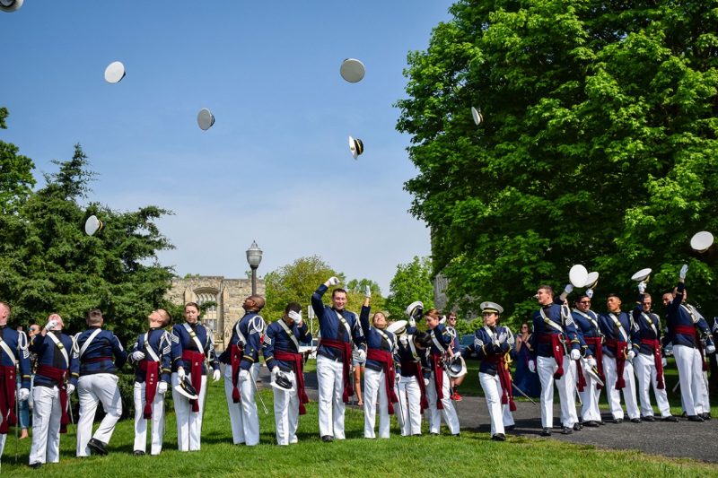 Senior cadets toss their covers in the air after the spring change of command ceremony.