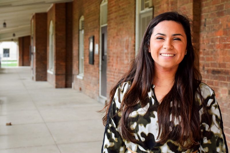Maddie Guillen poses in front of Lane Hall.