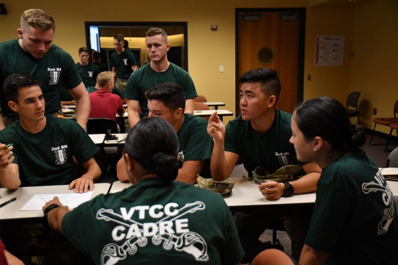 Cadets deep in conversation during group work 