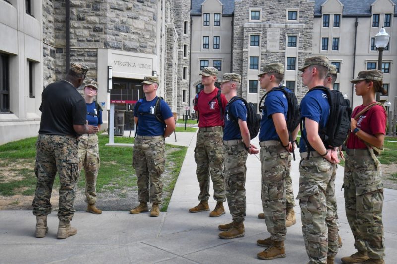 Cadets gather around a member of the commandant's staff for instruction during Cadre Week.