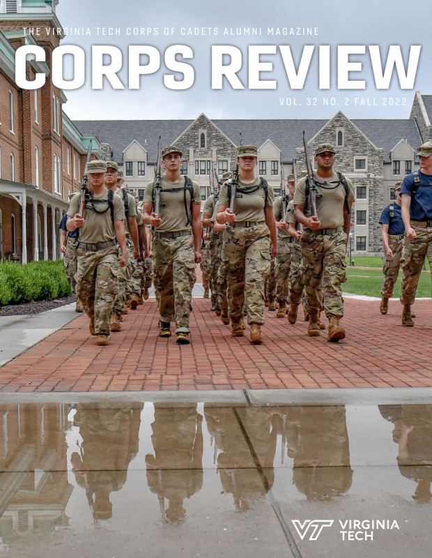 New cadets marching toward a puddle that shows their reflection and Lane Hall in the background on Upper Quad