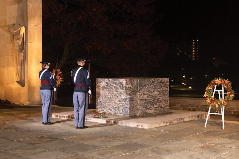 Two cadets face the centoaph at War Memorial Court at midnight.