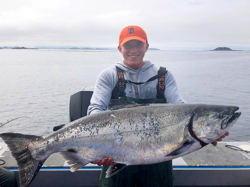 Cadet Corbin Will ’23 holds a large salmon.