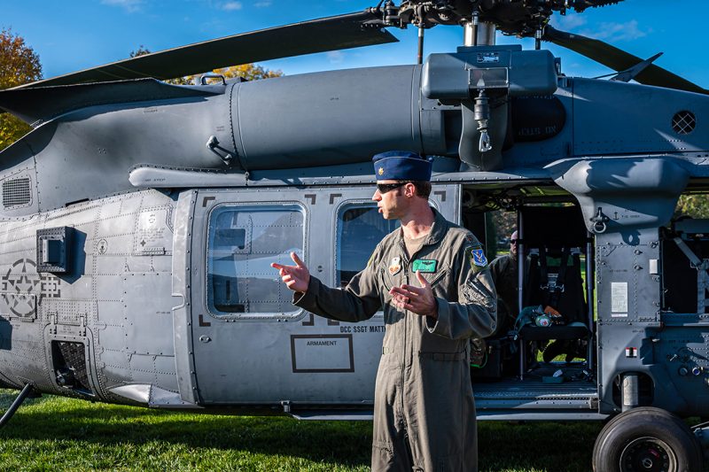 Maj. Adam Cade ’09 speaks with cadets after landing his HH-60 combat rescue helicopter on the Drillfield.