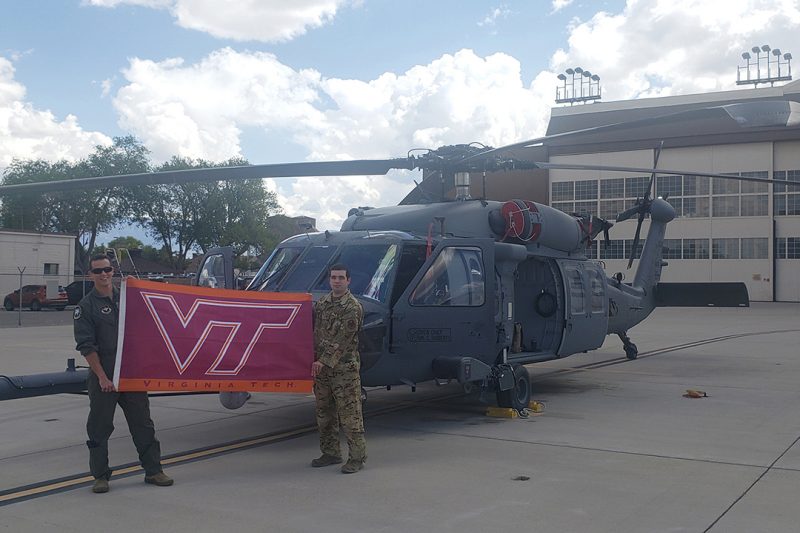 Maj. Matthew Johnson ’05 (left), commander of the 58 Operations Group, Detachment 2, and operations officer Maj. Joseph Ferrante ’06 stand in front of Kirtland Air Force Base’s first HH-60W combat rescue aircraft. 