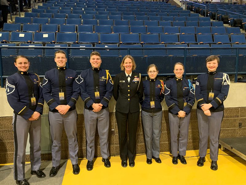 Capt. Valerie (Rud) Overstreet ’91 (at center) stands with a group of cadets.