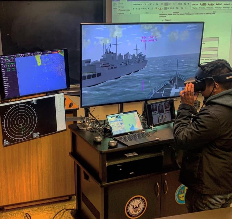 A midshipman operates a Conning Officer Virtual Environment unit.