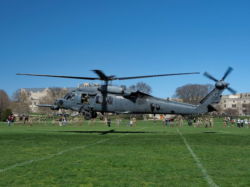 An HH-60 helicopter takes off from the Drillfield.