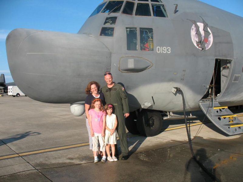The Ireland family in 2009 at Hurlburt Field, Florida, in front of the mighty MC-130H Combat Talon II.