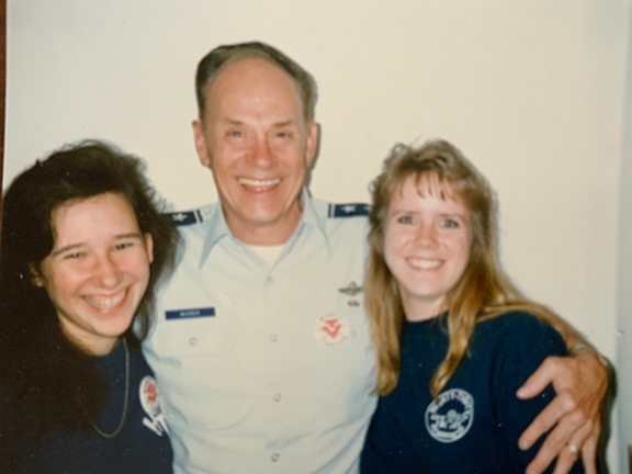 Vickie Ireland (at left) and fellow HT’91 bud Lori (McGrady) Walden with our commandant, the late Maj. Gen. Stan Musser (at center), in 1991.