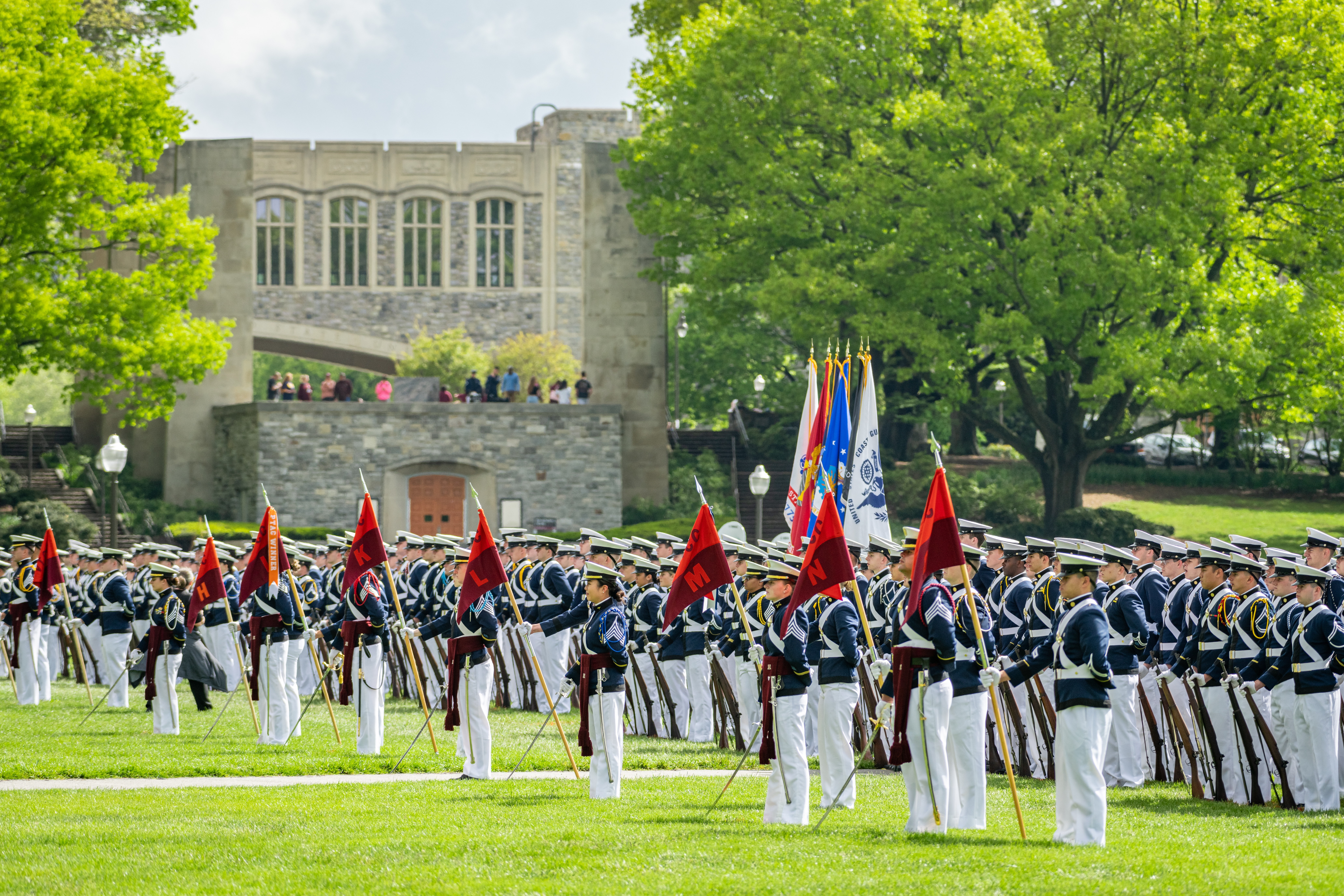 Cadets render honors while marching on the Drillfield.