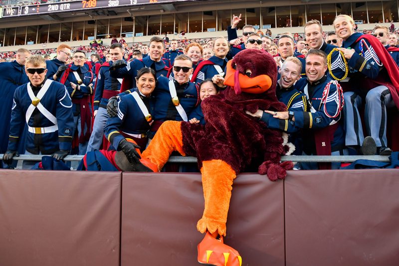 Cadets pose with the HokieBird in Lane Stadium.